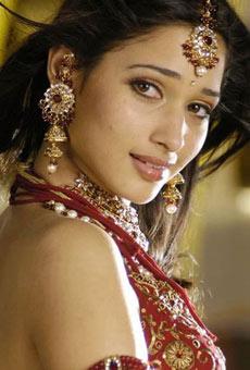 Young hero eyeing on Tamanna and Kajal.