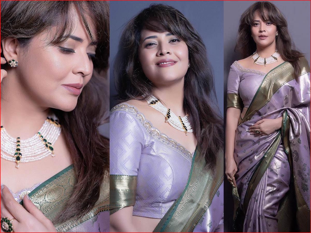 Anasuya Bharadwaj Stuns in Purple Saree