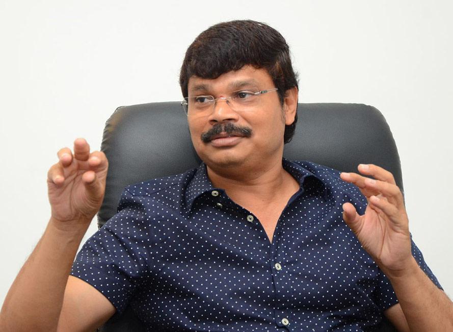 Mass director with Akkineni Prince or Energetic Hero?