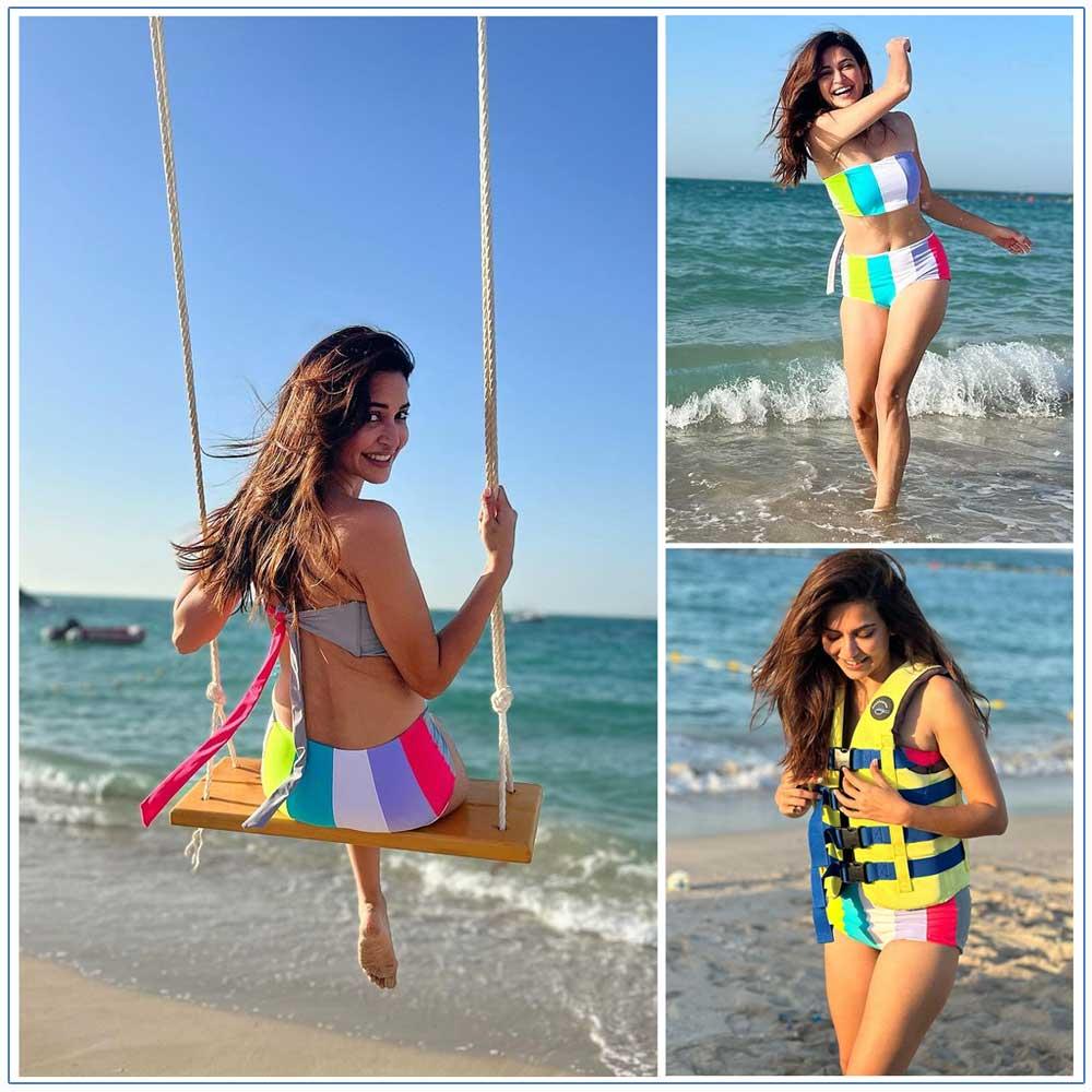 Kriti Kharbanda turns rainbow at beach