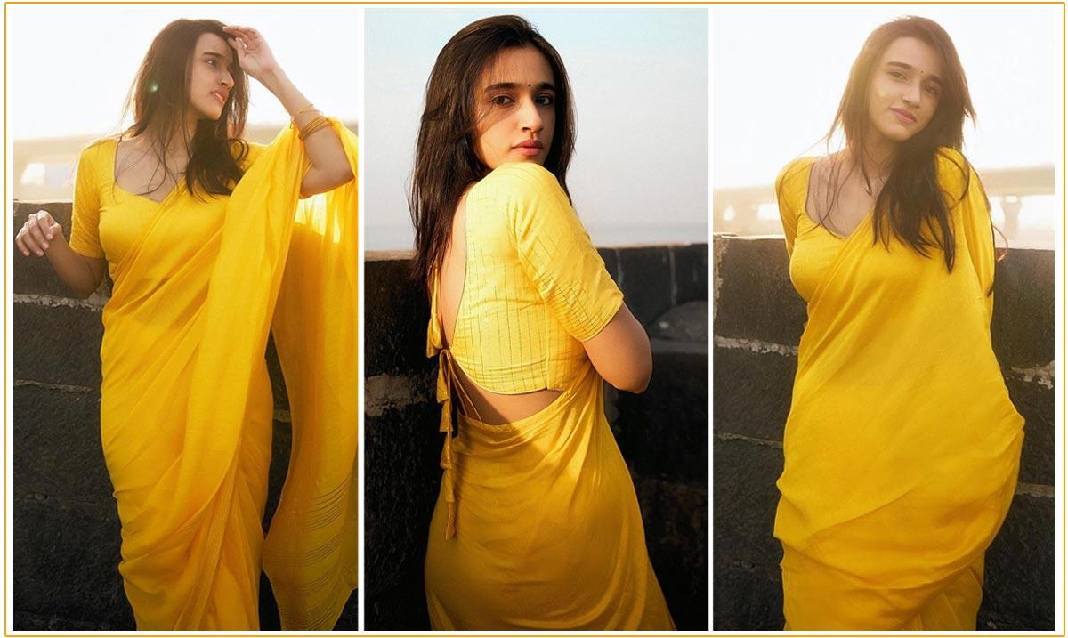 Nuveksha Teases In Yellow Saree
