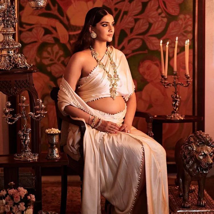 Sonam Kapoor flaunts her baby bump in an ivory drape in new photos