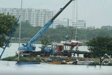 Crane assists Indian Navy men