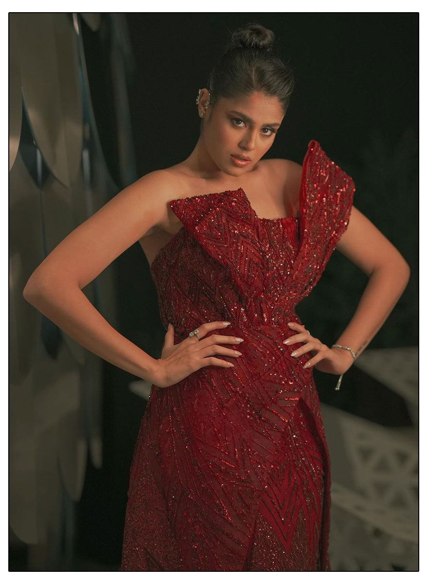 Faria Abdullah exuding elegance and confidence in a stunning red gown