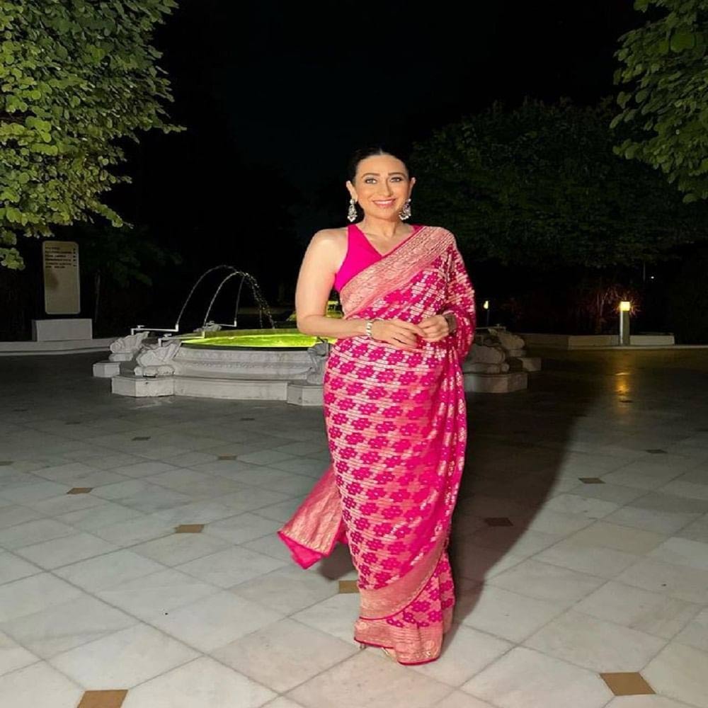 Karisma goes for the kill in Pink Saree