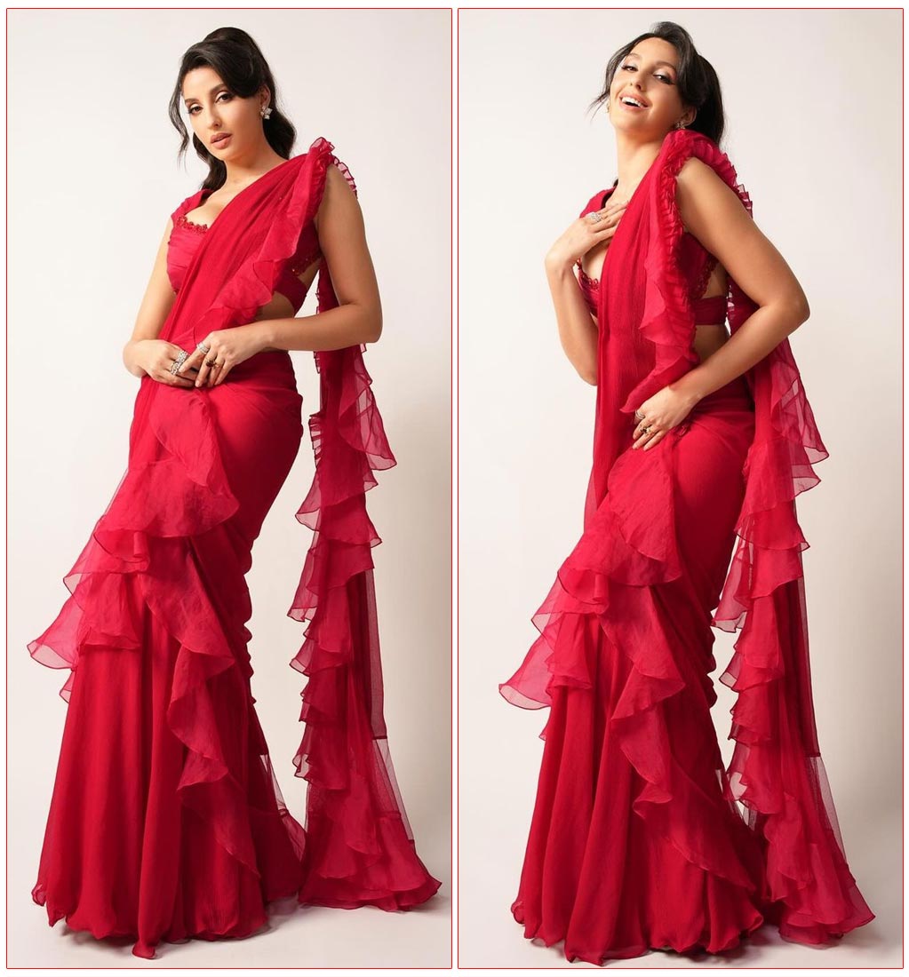  Nora Fatehi dazzles in a fiery red saree 