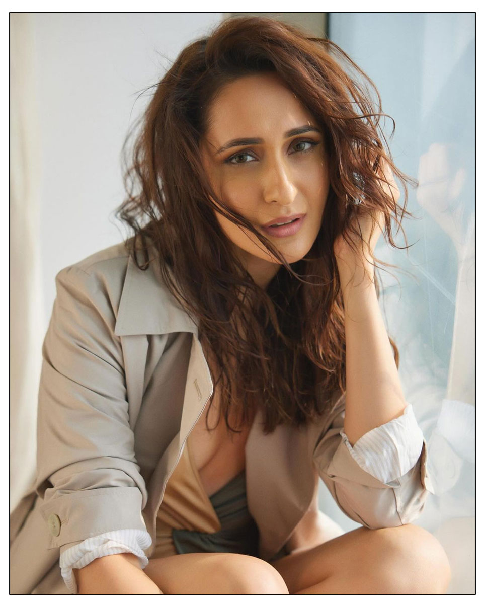  Pragya Jaiswal showcasing her in a striking cream and black 