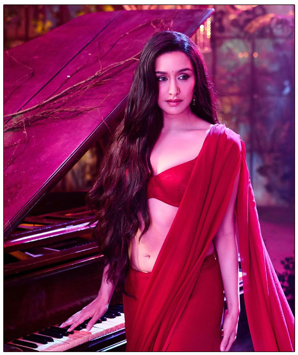 Shraddha Kapoor featuring her gracefully draped in a stunning red saree 