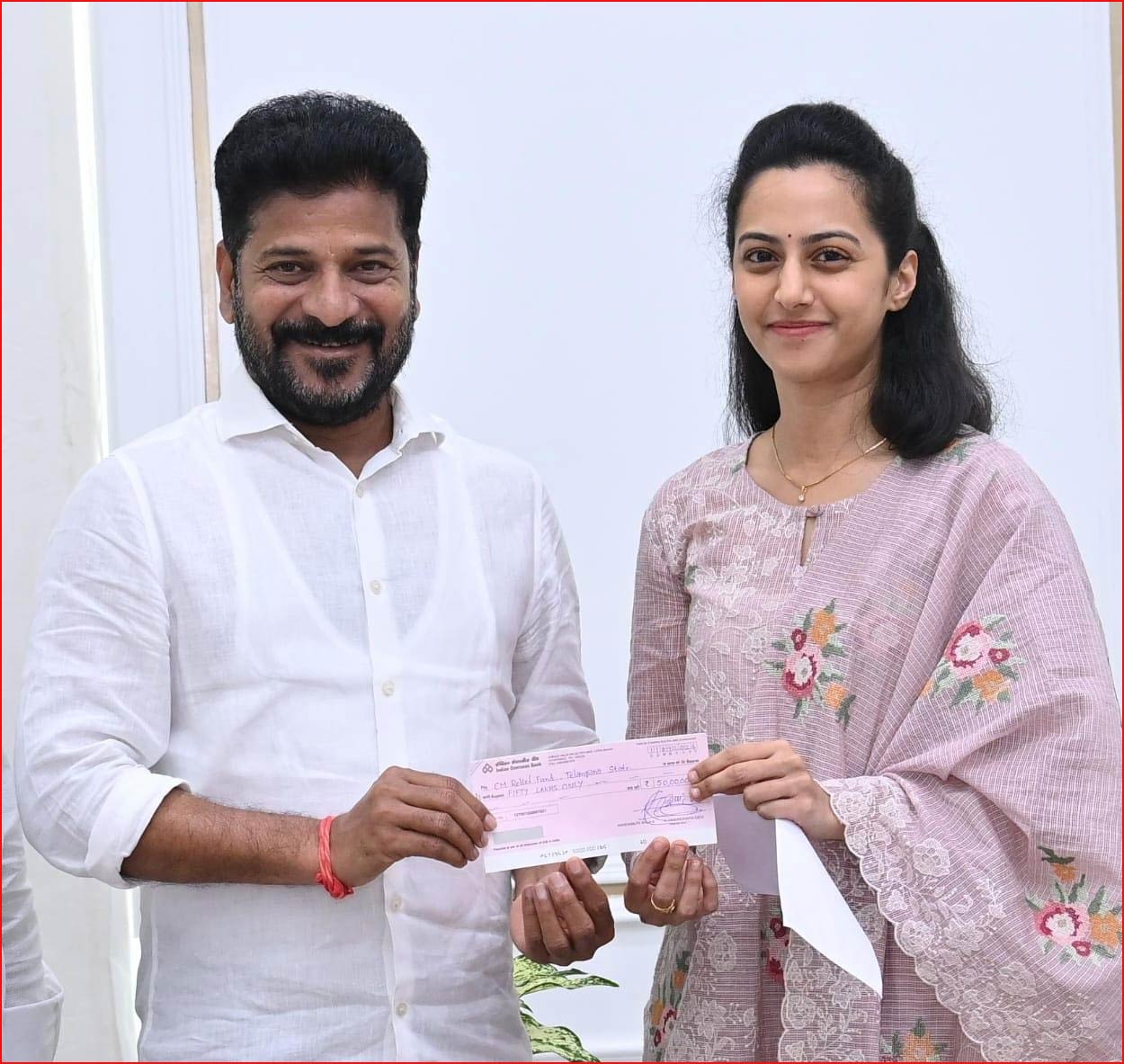 Tejaswini meets Revanth Reddy and donates for flood victims on Balakrishna behalf