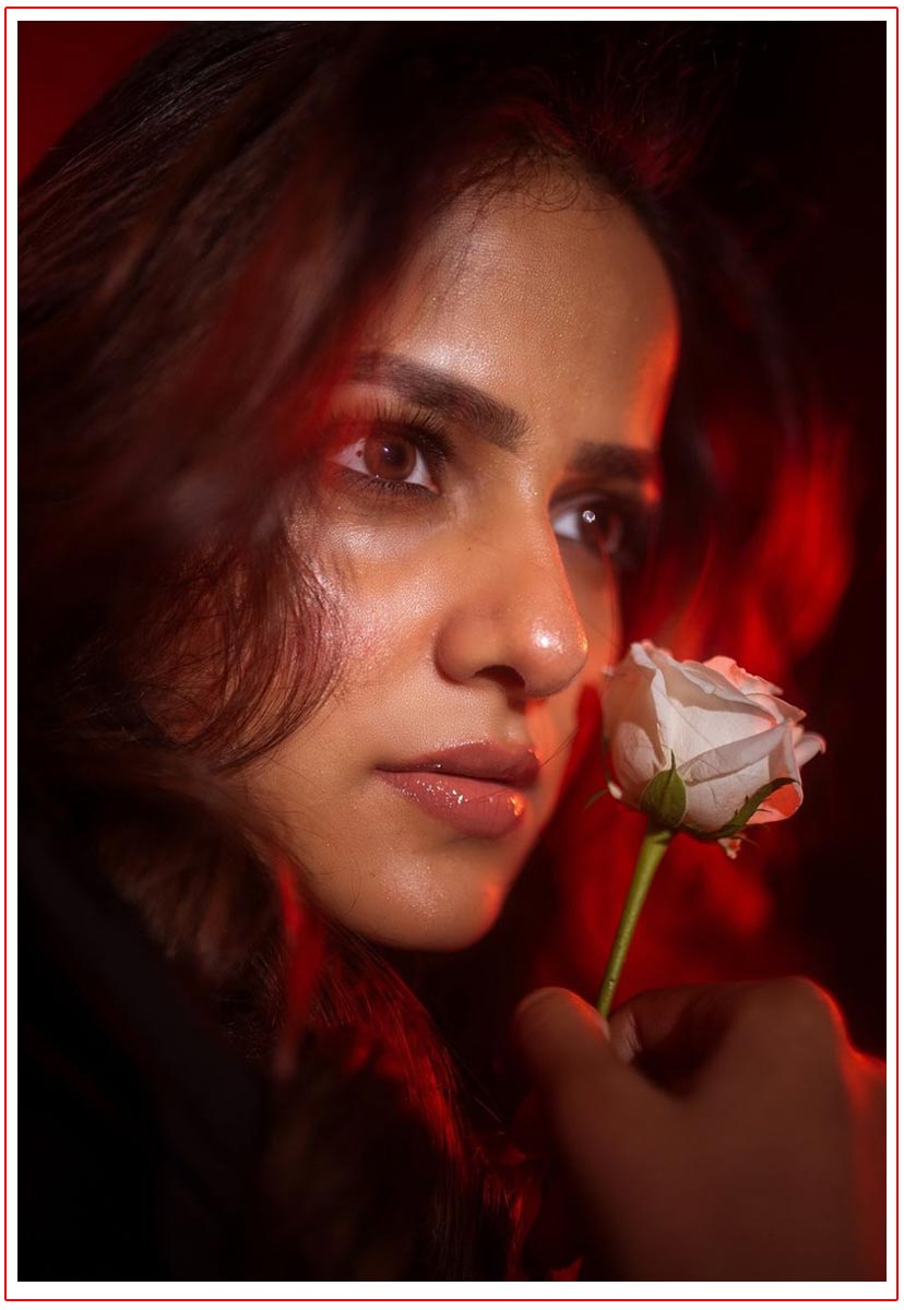 Vaishnavi Chaitanya poses delicately holding a white rose