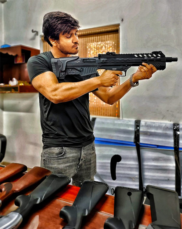 What is Nikhil doing with weapons?